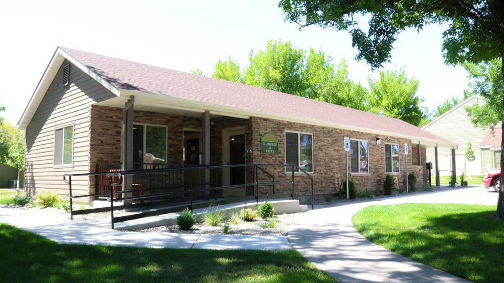 a brick building with a porch on the side of it