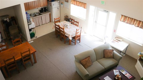 a living room and dining room with a table and a couch