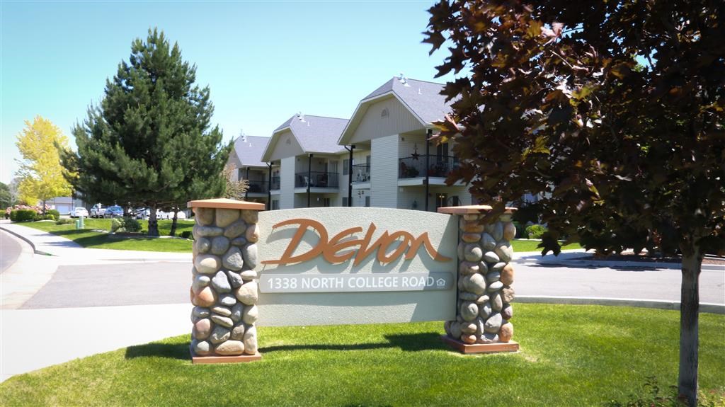 a sign in front of a building