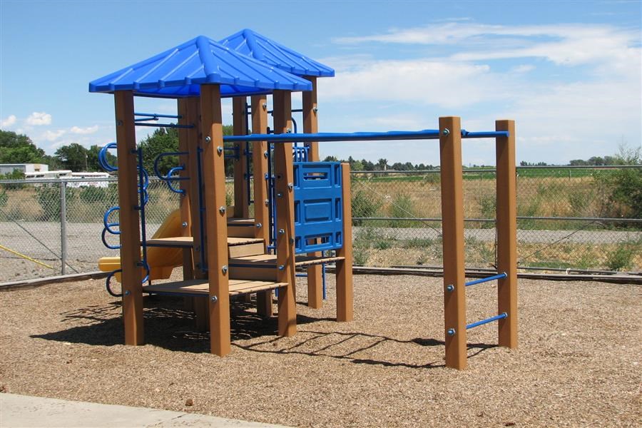 a playground with a blue play set