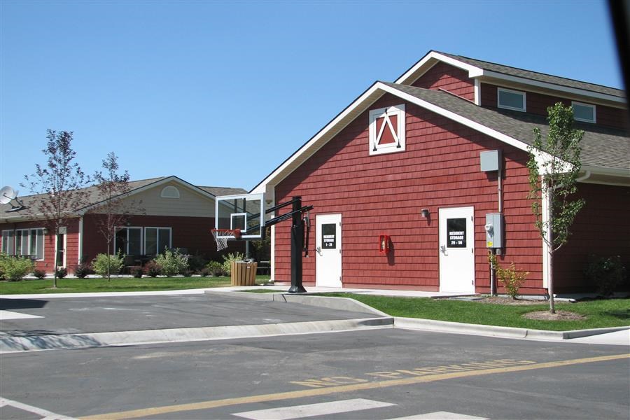 a red building with a red fire hydrant in front of it