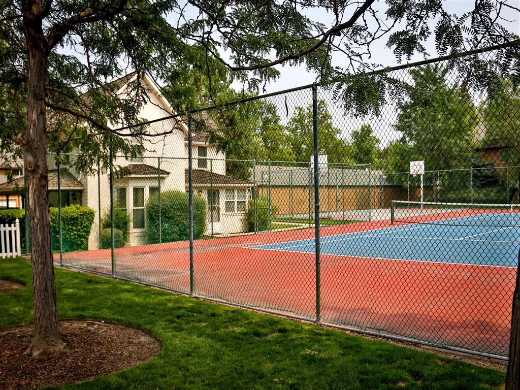a tennis court with a fence around it