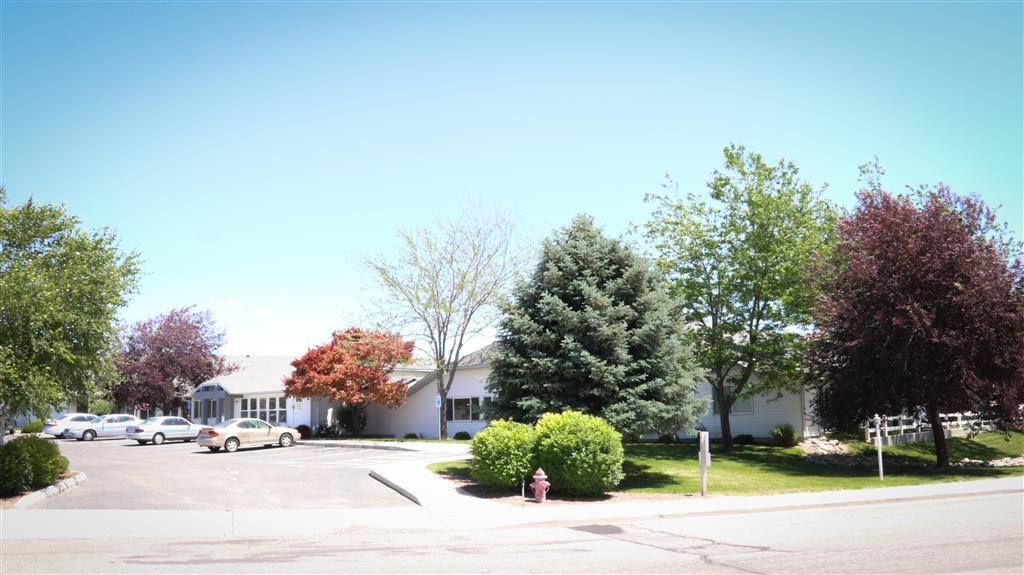 a street with cars parked in a parking lot