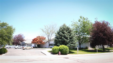 a street with cars parked in a parking lot