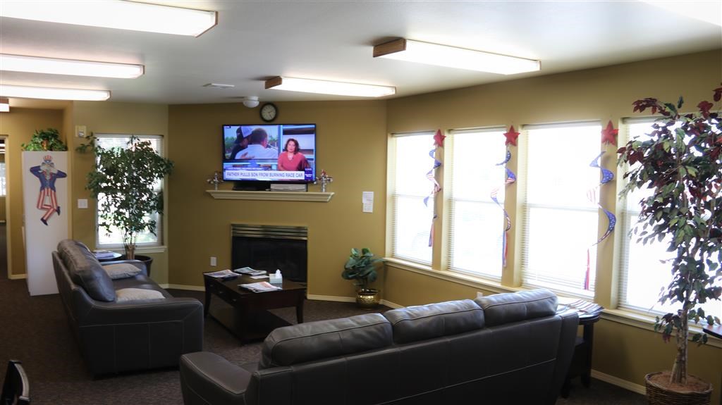 a living room with couches and a television in it