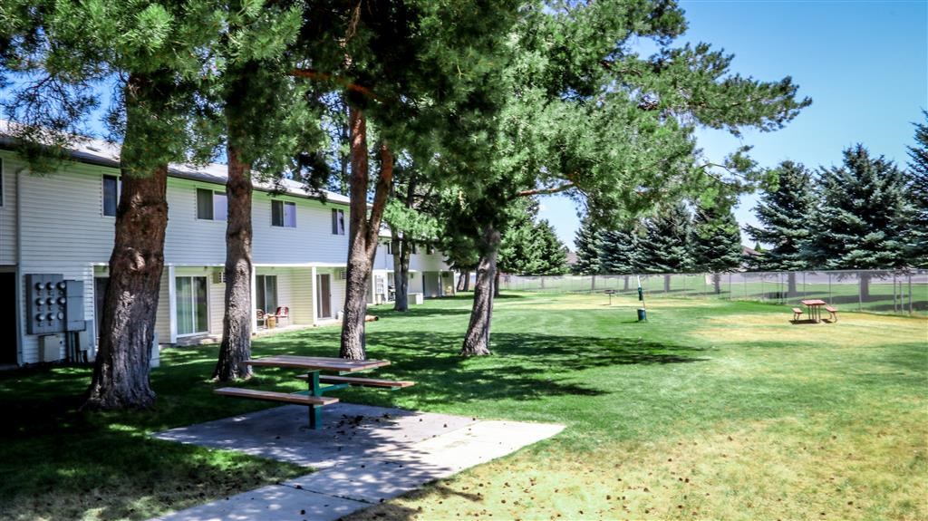 a picnic area in front of a white house