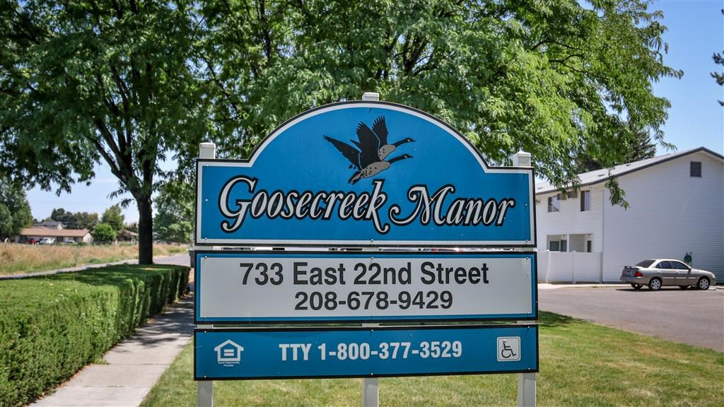 a blue sign that reads on a street