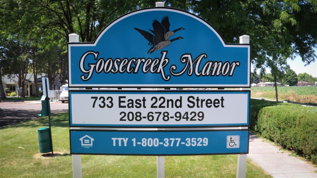 a blue sign that reads on a street