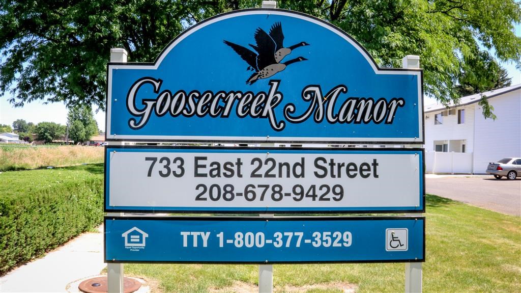 a blue sign that says with a bird on it