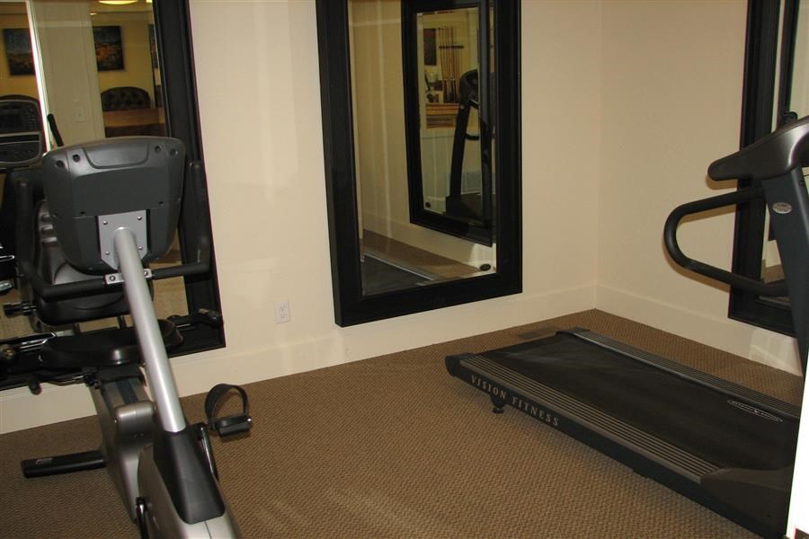 a exercise bike in a room next to a mirror