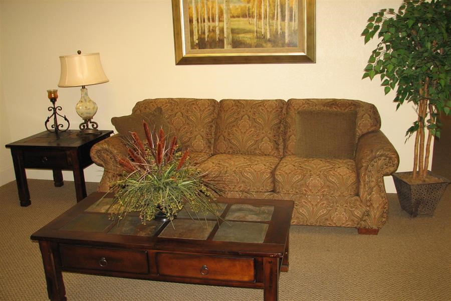 a living room with a couch and a coffee table