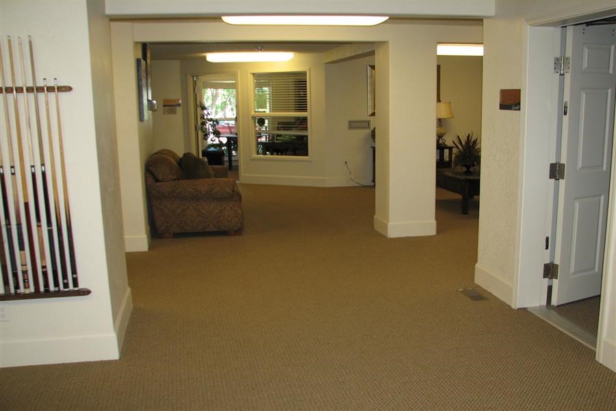 a living room with a couch and a door