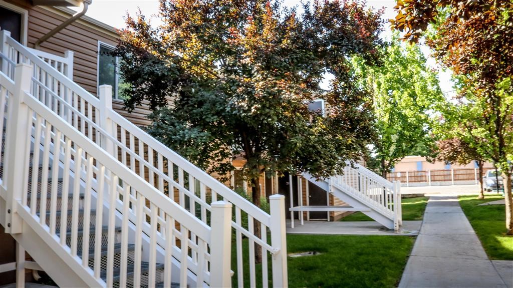 a white fence in front of a house