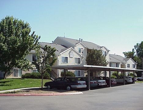 a row of cars parked in a parking lot