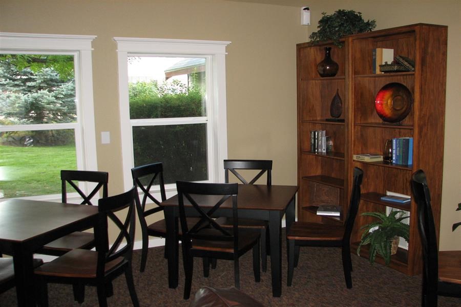 a dining room with a table and chairs