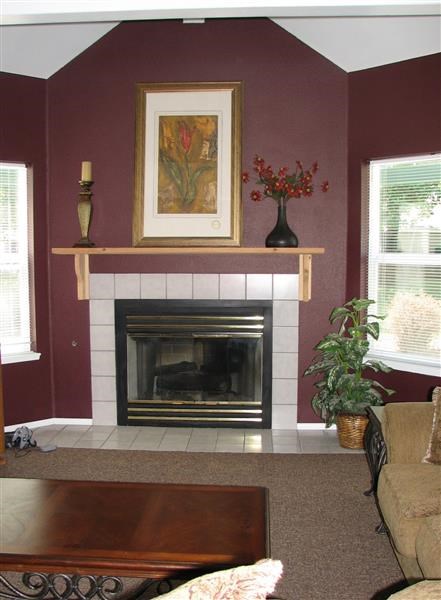 a living room with a fireplace and a table