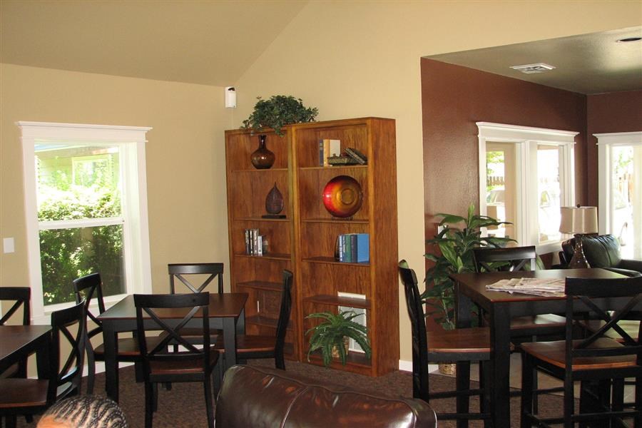 a dining room with a table and chairs