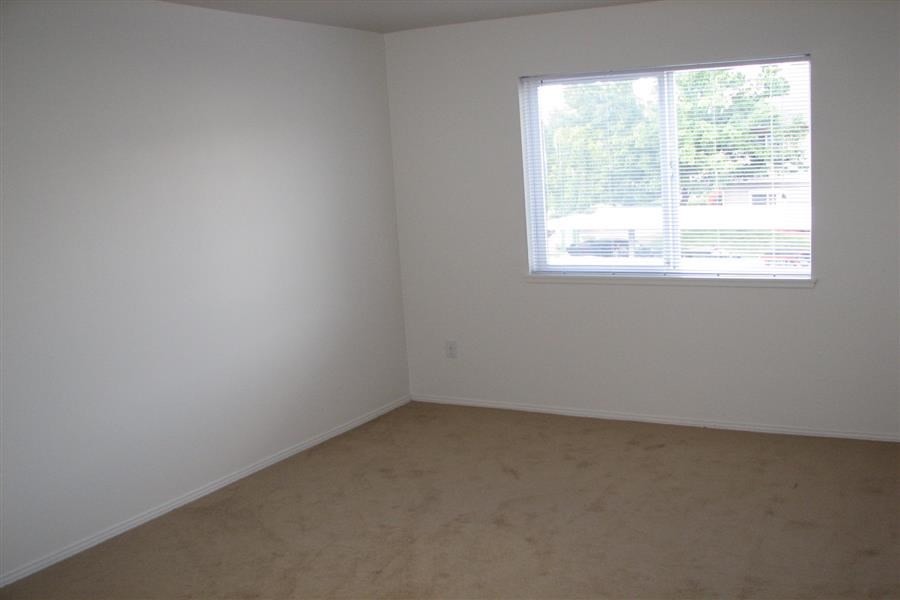 an empty room with a window in it