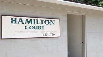 a sign court on the side of a building