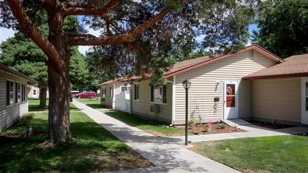 a row of houses on the side of a street