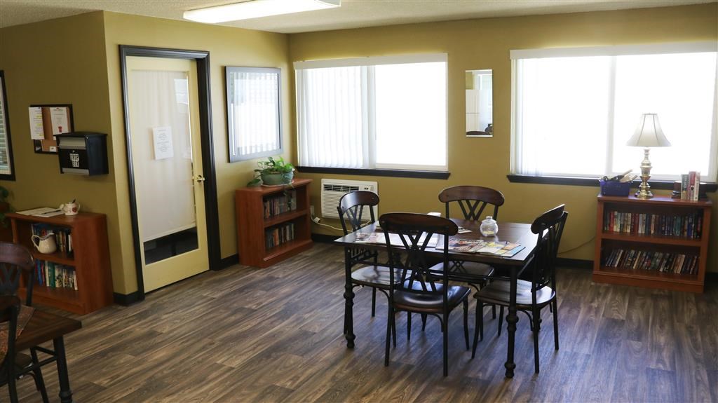 a dining room with a table and chairs