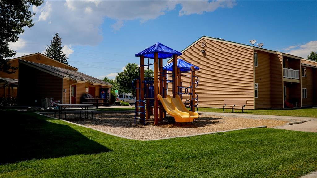 a childrens playground with a swing set