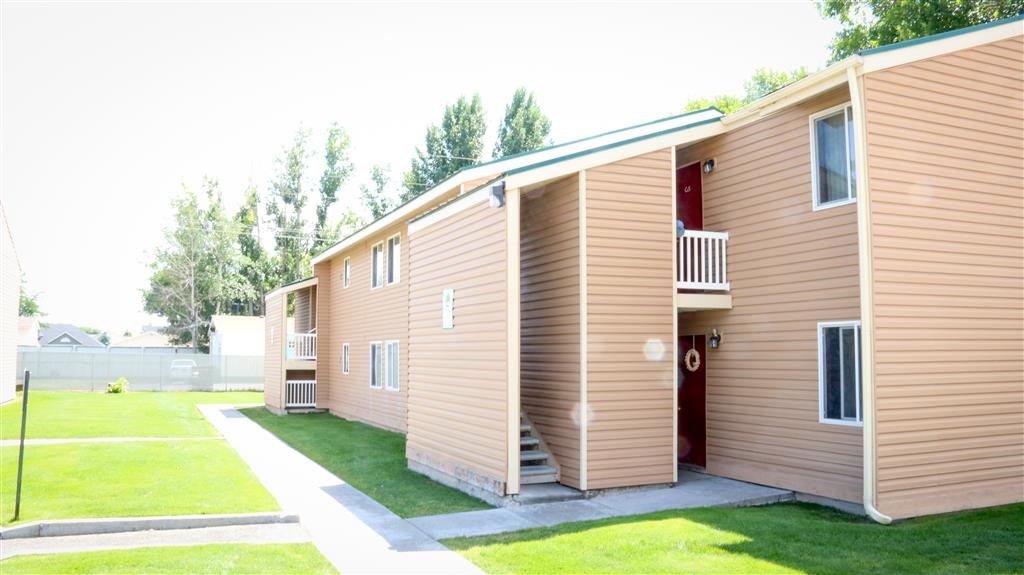 a row of modular housing units in a yard