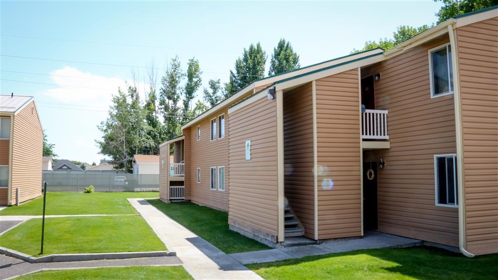 a row of modular housing units in a yard