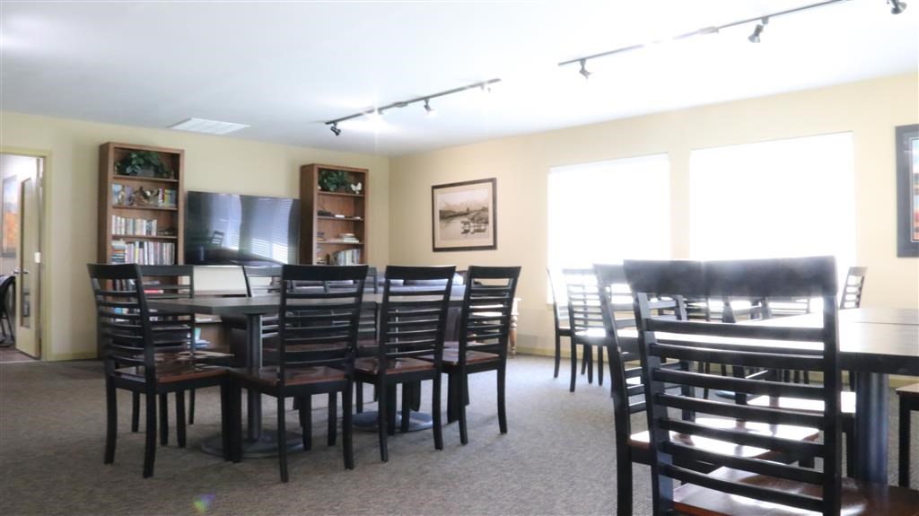 a dining room with a table and chairs