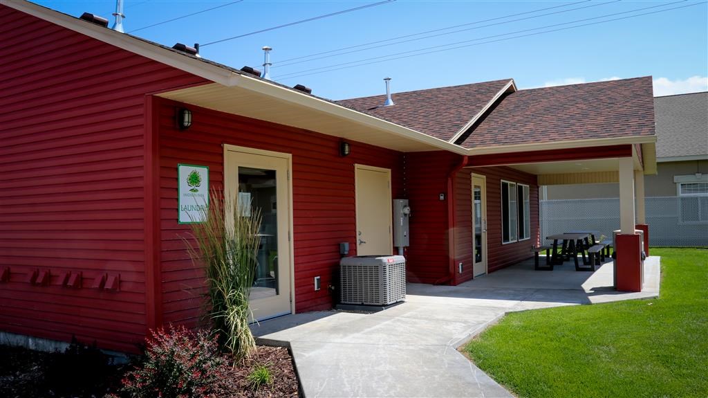a red house with a patio and a porch