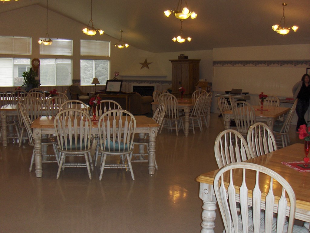 a large room with tables and chairs and chairs