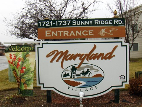 a sign that sign with the name of the town of