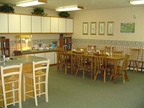 a large dining room with a table and chairs