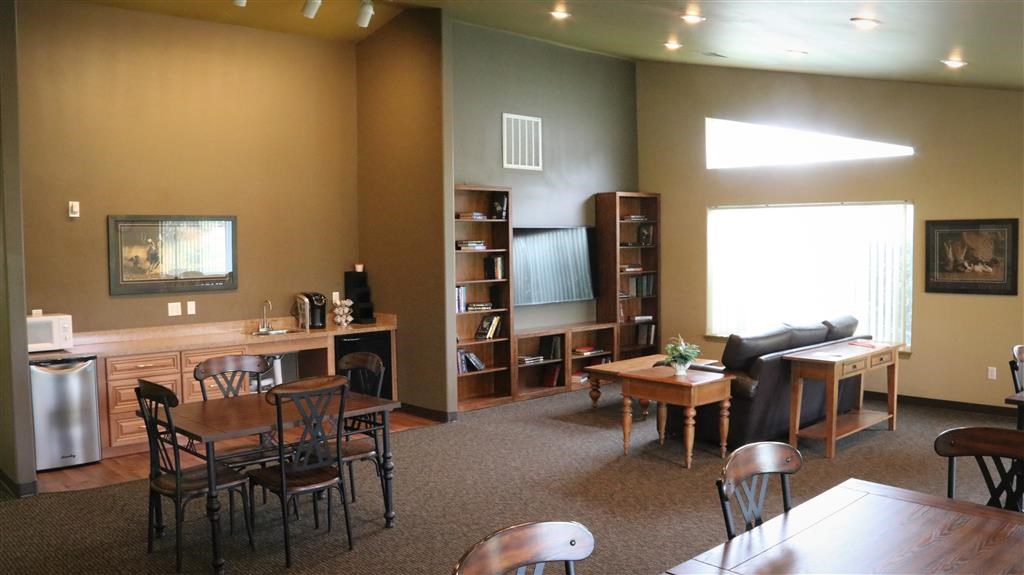 a living room with tables and chairs and a couch