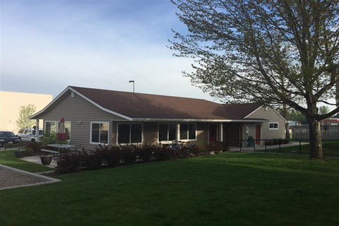 a house with a yard in front of it