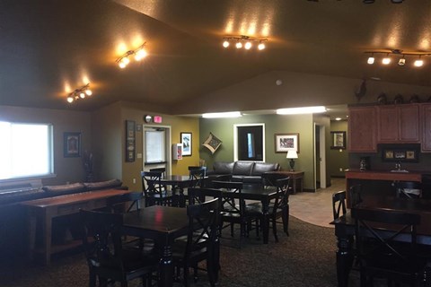 a restaurant with tables and chairs and a living room