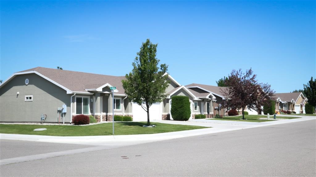 a row of houses on the side of a street