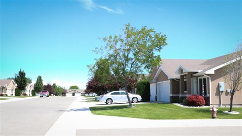 a white car parked in the driveway of a house
