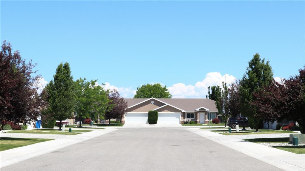 a house in a neighborhood with a empty street