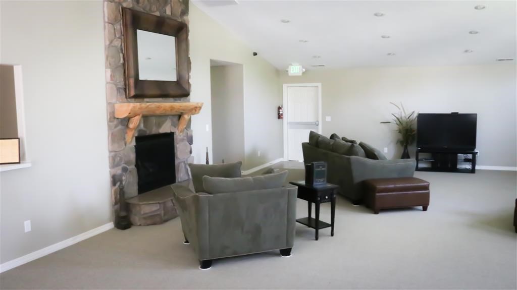 a living room with couches and a television