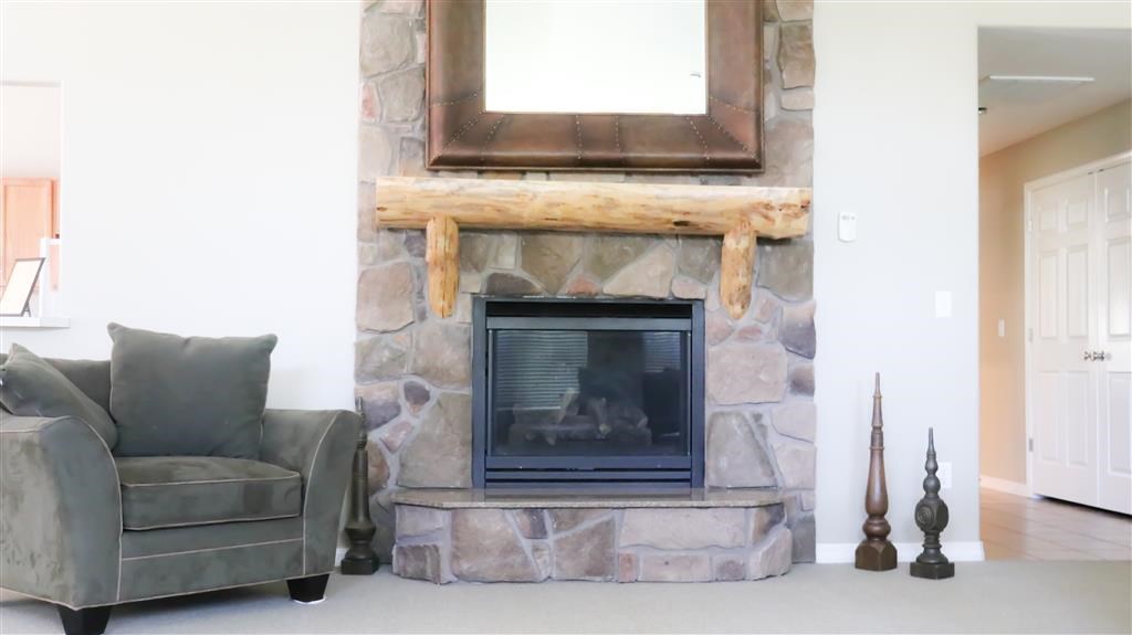 a living room with a fireplace and a couch