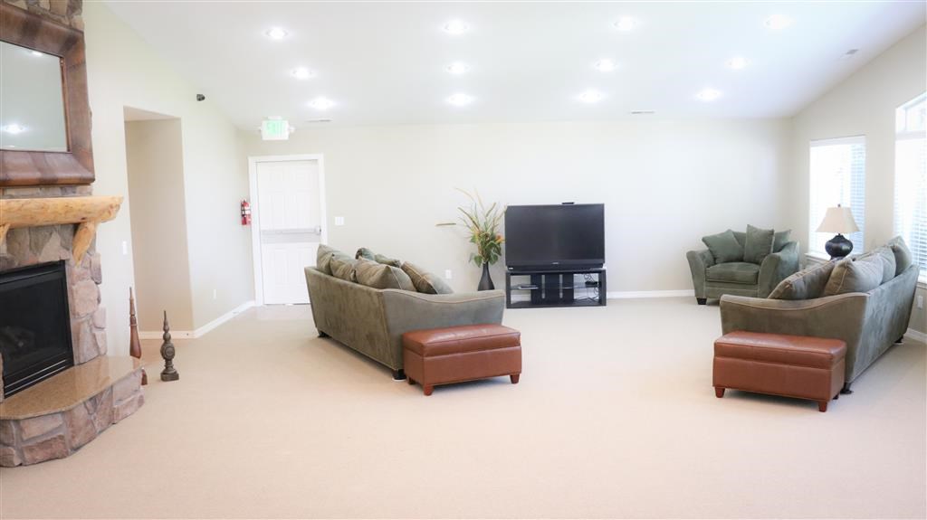 a living room with two couches and a television