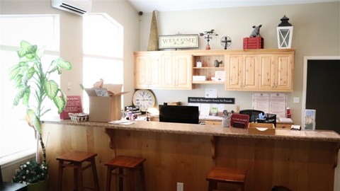 a kitchen with a counter and some stools