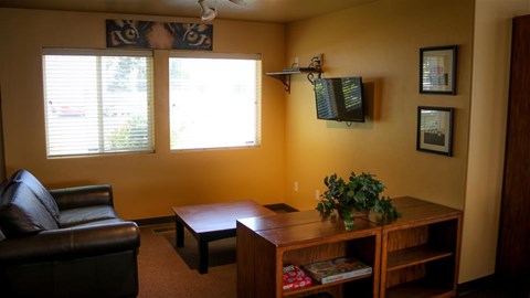 a living room with a couch and a table