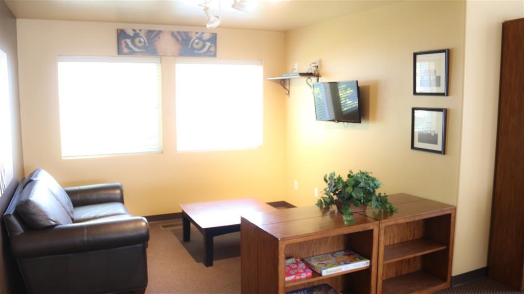 a living room with a leather couch and a coffee table