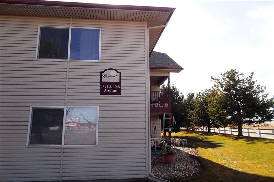 a white building with a sign on the side of it
