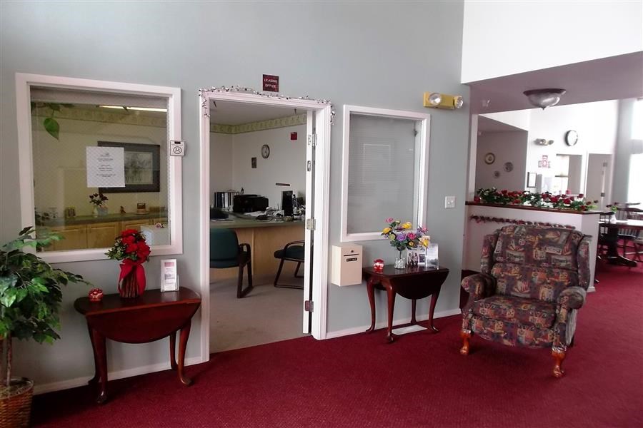 a living room with a chair and a table