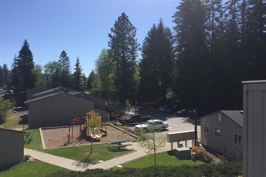 an aerial view of a neighborhood with houses and trees