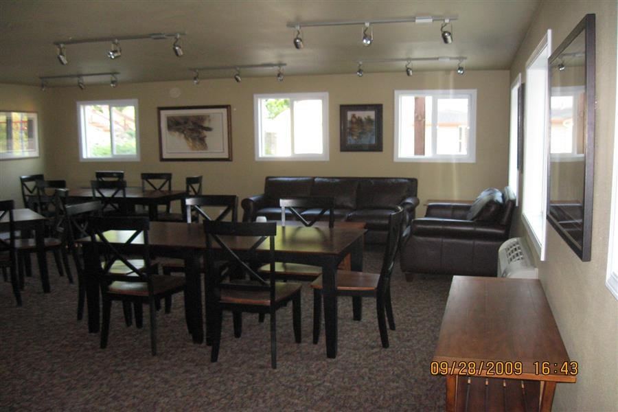 a dining room with tables and chairs and a couch