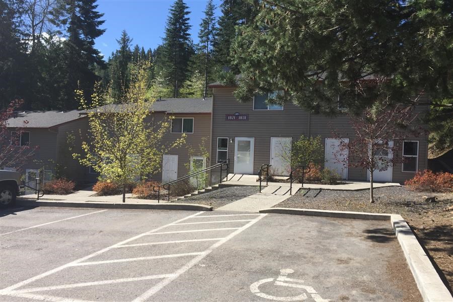a building with a parking lot in front of it